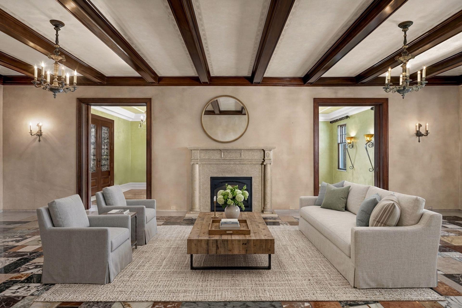 Beamed living room with fireplace and stone flooring (virtually staged)