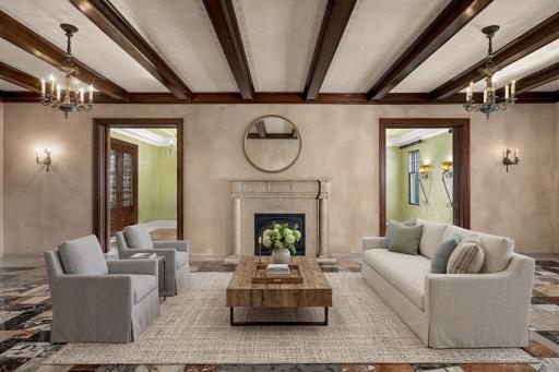 Beamed living room with fireplace and stone flooring (virtually staged)