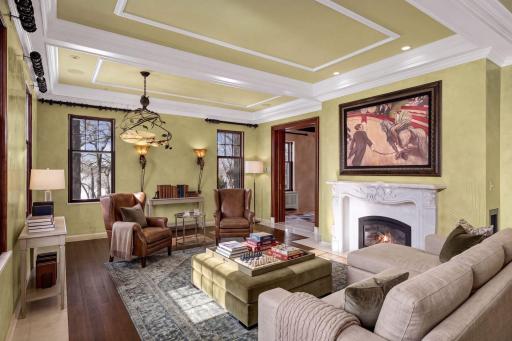 Bright & airy sunroom with fireplace & rear terrace access (virtually staged)