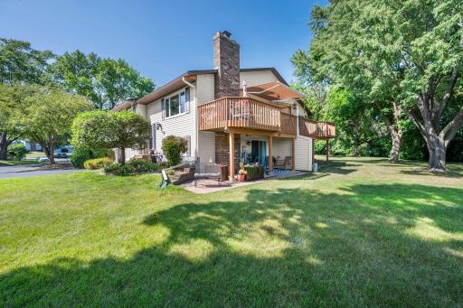 Home has a large deck off the dining area and a covered patio off the lower level.