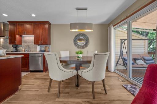 The quality is evident, from the remodeled kitchen with cherry cabinets to the porcelain tile floors and stunning light fixture.