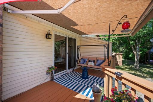 This large deck is right off the dining area. The owners had an "intelligent" retractable awning installed and it stays with the house!