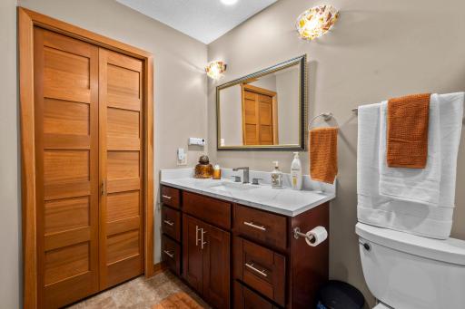 Upper level three-quarter bath. Bath was remodeled in 2018 with quality materials including porcelain tile floors and new lighting.