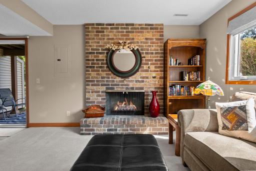L-shaped family room walks out to a private patio and a huge grassy area between the house and lake.