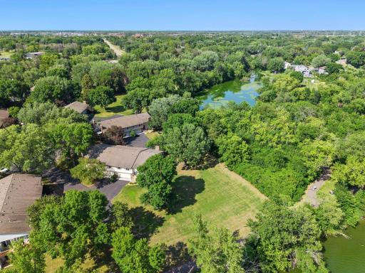 Drone view open space between lake and home