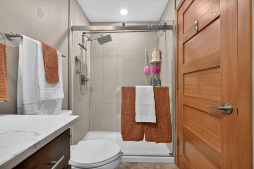 Upper bath - gorgeous tiled, step-in shower with glass doors!