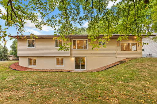 Unique Walkout Rambler! A rare design featuring a spacious walkout lower level with direct backyard access. Large windows bring in plenty of natural light, while the mature trees and peaceful setting create a private feel.