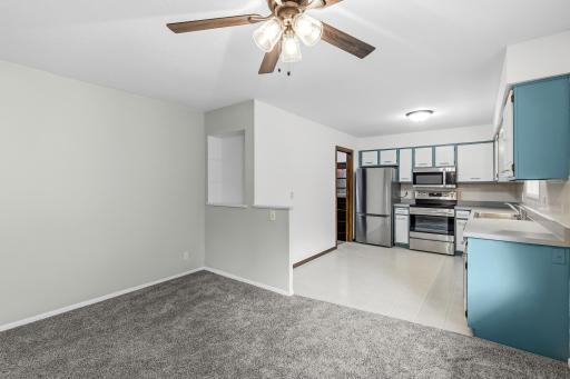 Open dining area flows seamlessly into the kitchen, offering a comfortable space for everyday meals and entertaining. Bright kitchen features stainless-steel appliances, ample cabinetry and a functional layout.