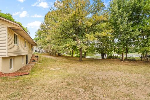 Rare waterfront setting! Enjoy peaceful lake views from the spacious backyard, surrounded by mature treesâan incredible setting for relaxing, entertaining and enjoying nature right at home.