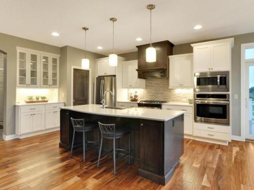PHOTOS/VIRTUAL TOURS SHOWN ARE OF A PREVIOUS MODEL HOME AND MAY DEPICT OPTIONAL FEATURES, AND FINISHES NOT INCLUDED IN THE BASE PRICE.