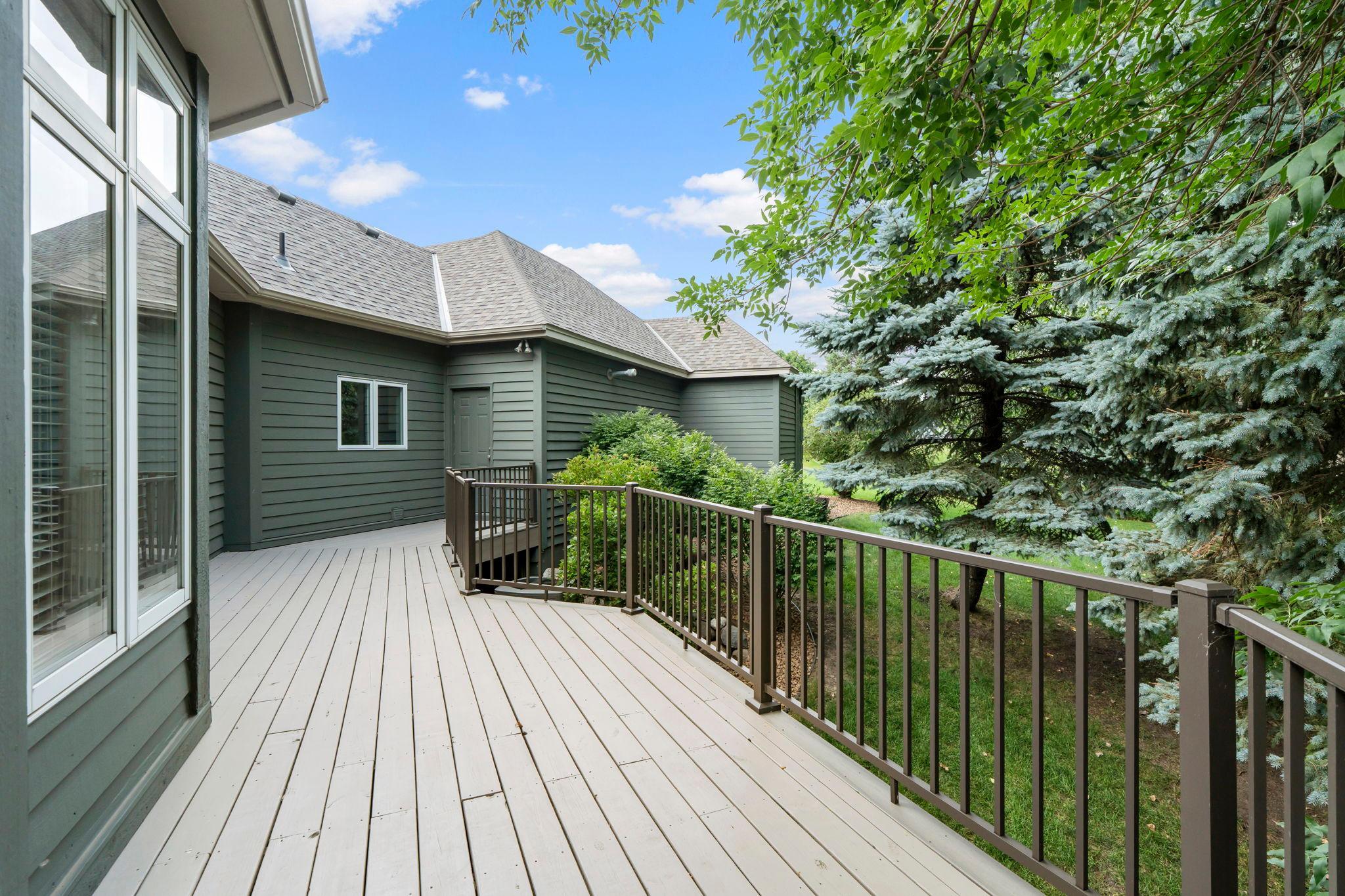 Deck wraps around with access to the garage