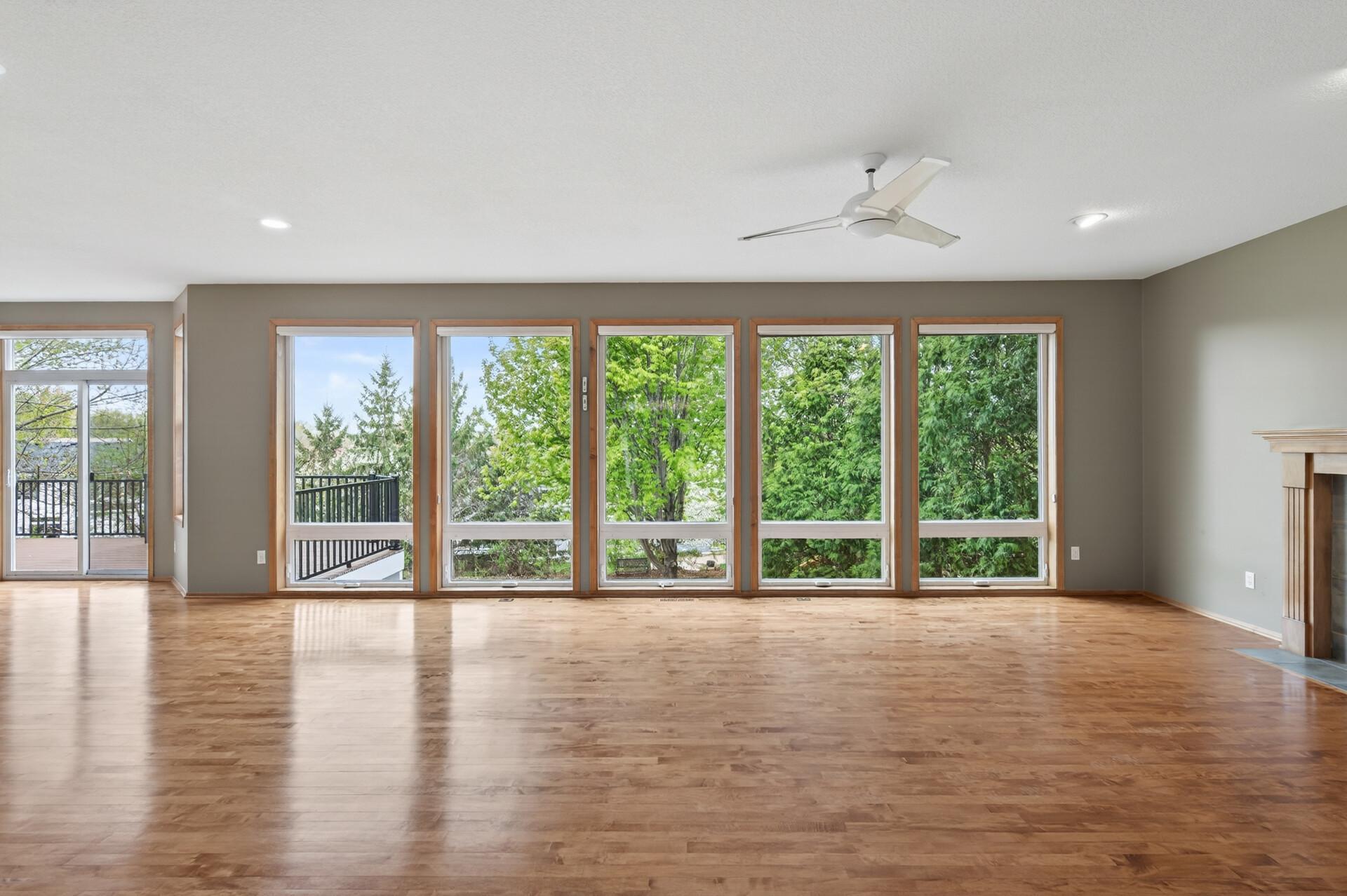 Living room windows overlooks the back yard