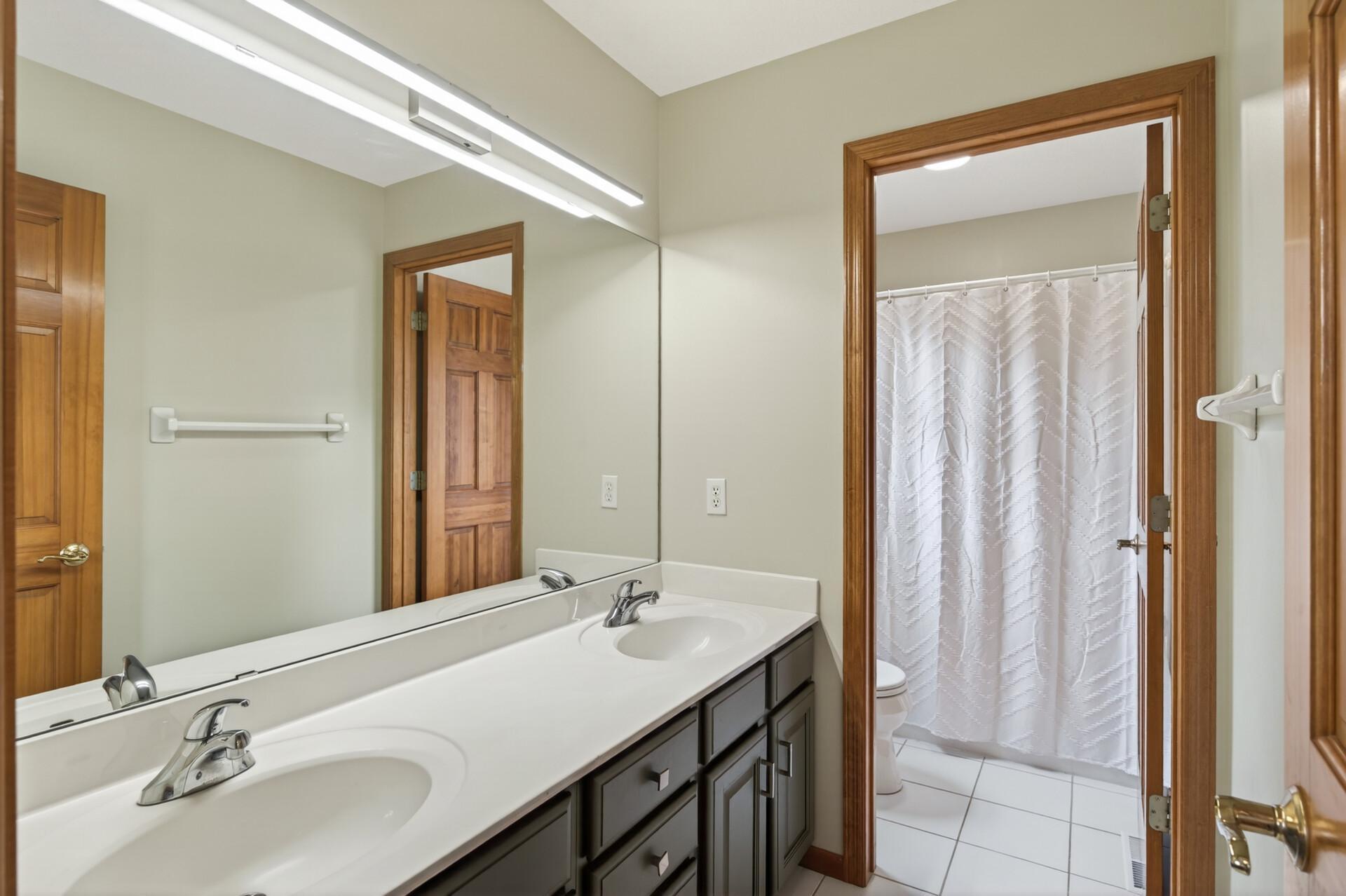 Upper level full bath with tile floors