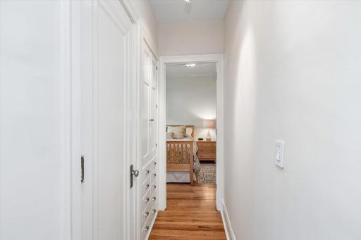 Hallway to bathroom, linen closet & build-ins to bedroom