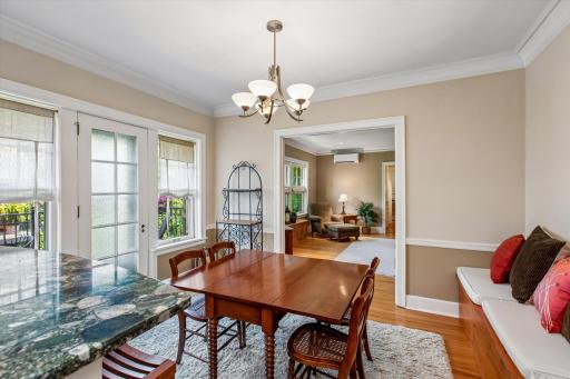 Formal dining room view to living room & balcony