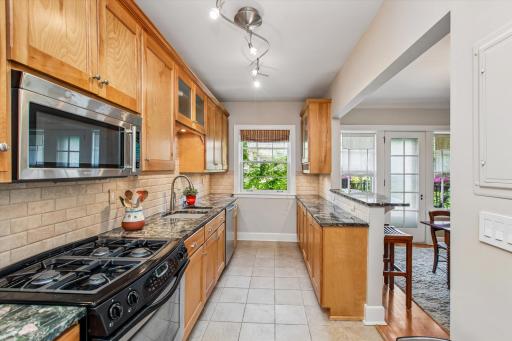 Huge kitchen with one of a kind granite counter tops and stainless steel appliances