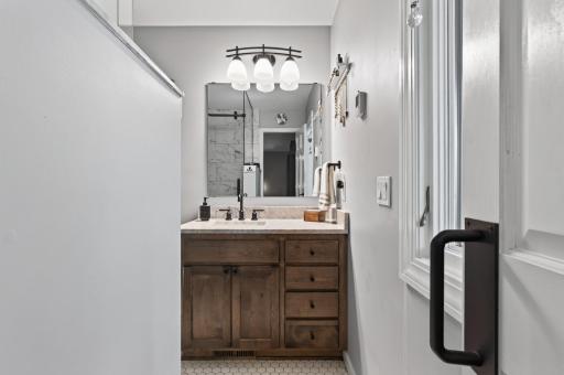Remodeled ensuite bathroom with heated floors.