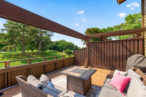 Tranquil sitting area on the large deck with new arbor beam.