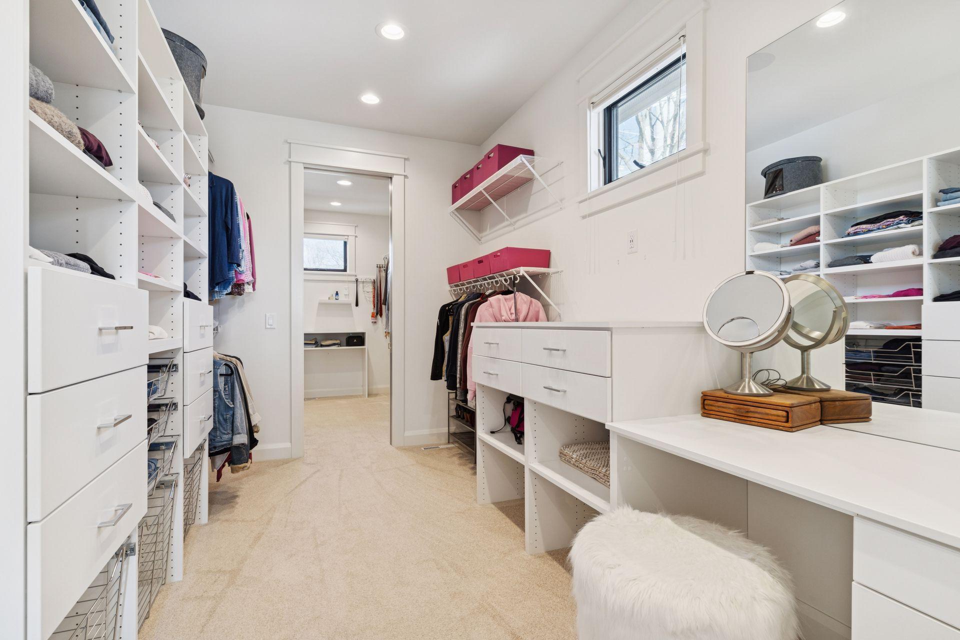 Primary His/Hers Closet - custom makeup vanity built in