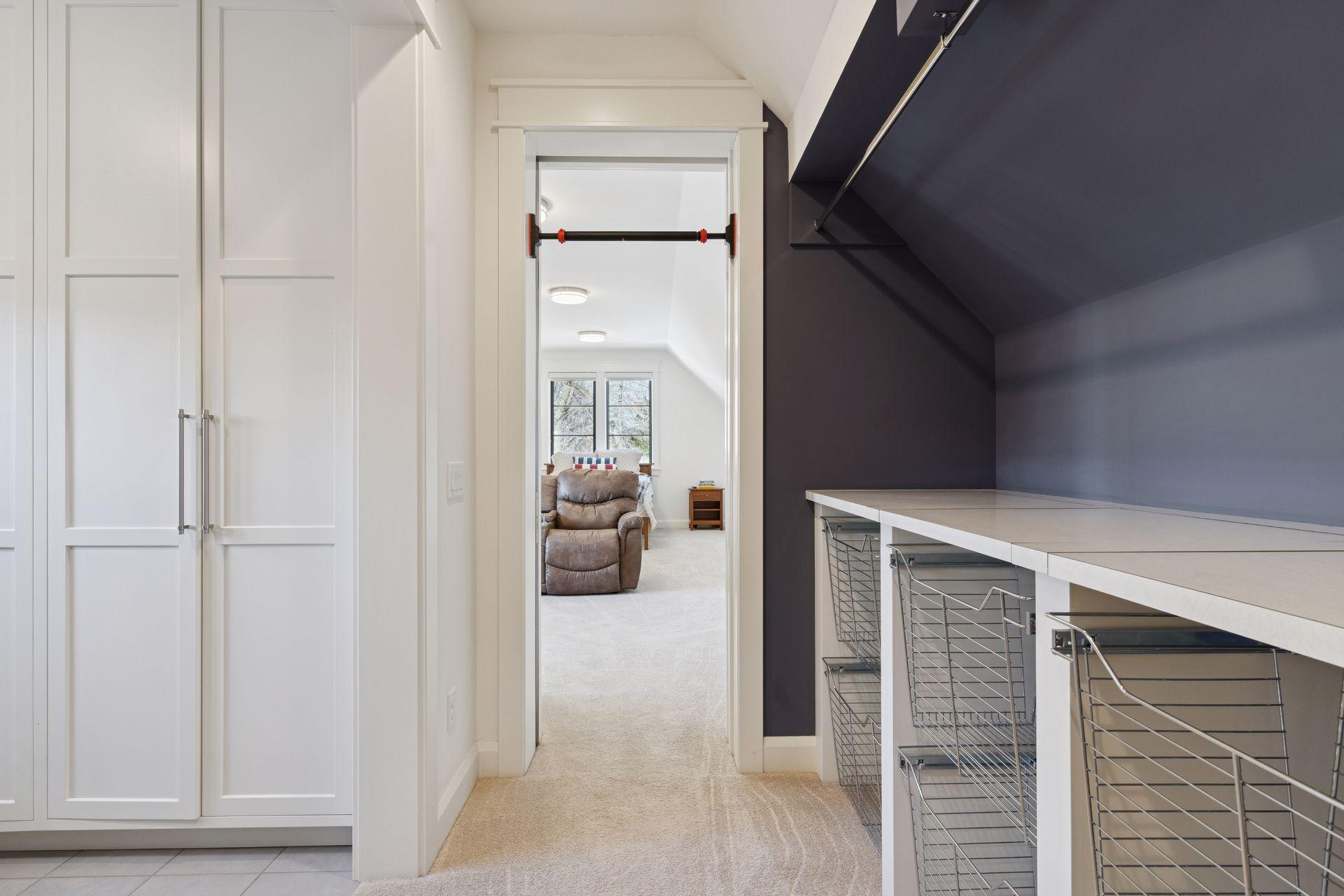 Laundry Room with Custom Bins to fit all closets