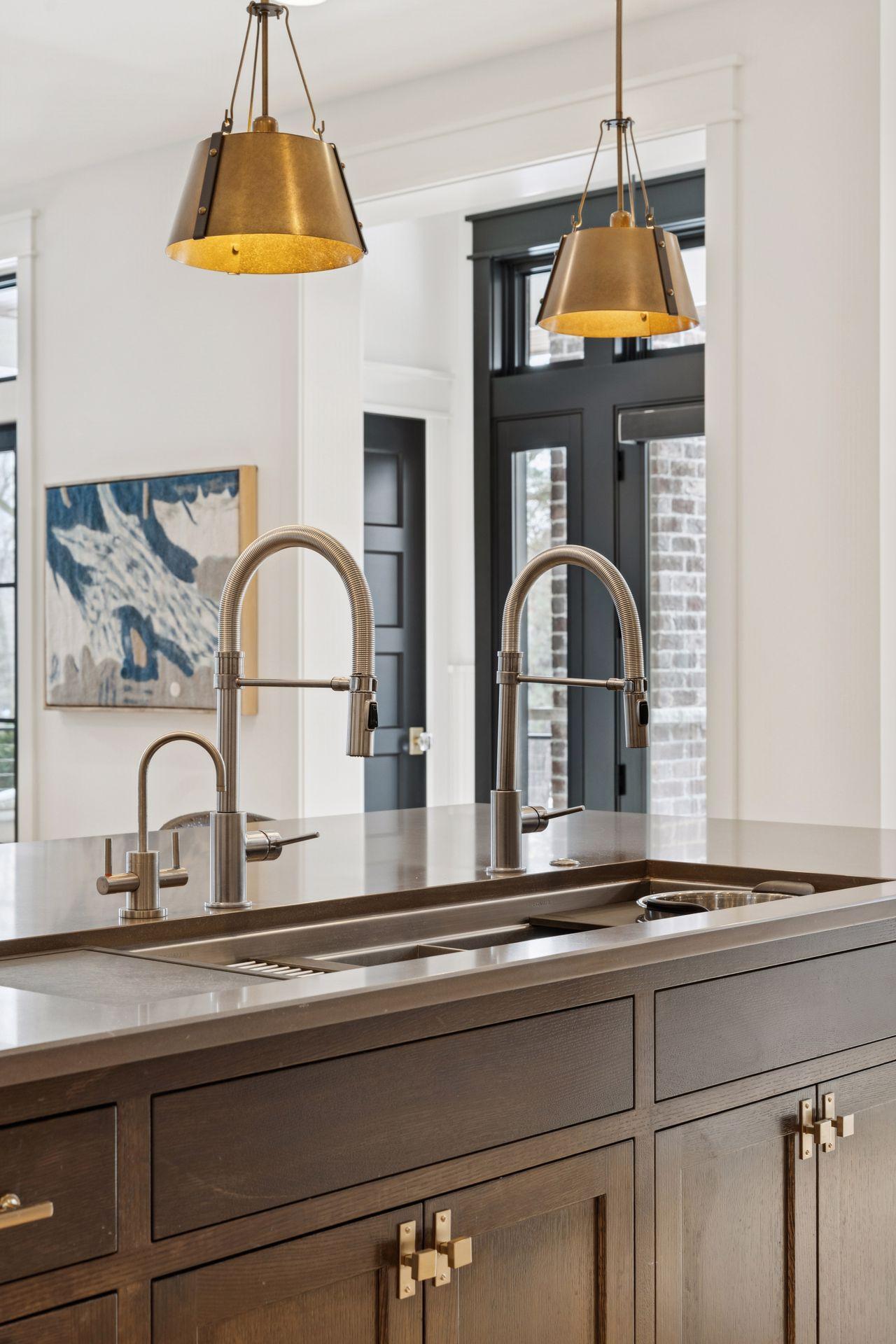 Workstation Sink with sliding pieces including colander, cutting board, etc.