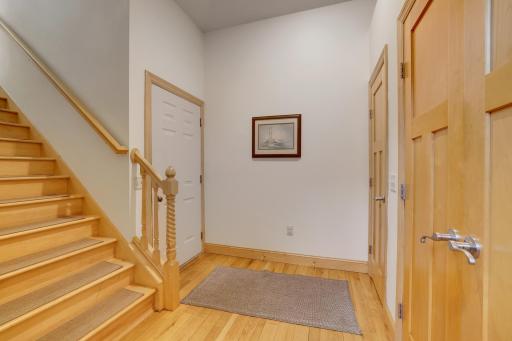 Back foyer leads to garage and upper level suite