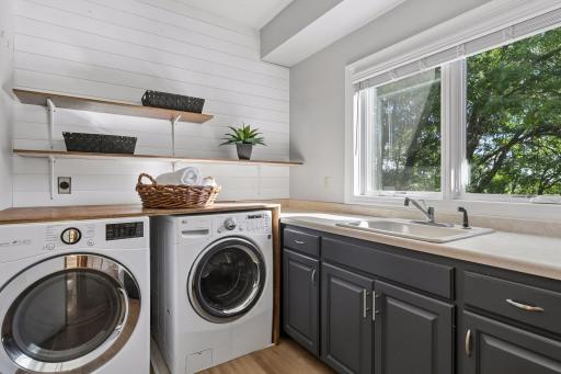 Main floor laundry with a view - light and bright. Located conveniently just off of the kitchen.