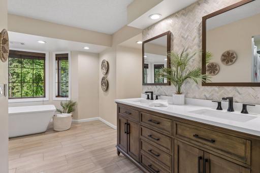 Plenty of natural light, toilet area is inset (on the right) and the wall tile makes this space special and elevated.