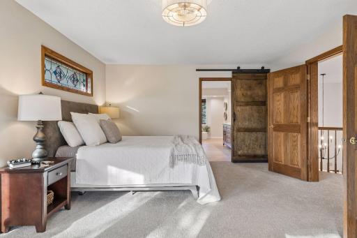 Wonderful flow to this space with beautiful french doors and barn style door to the bath suite