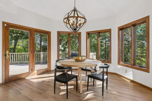 Special eat-in dining area overlooking the evergreens and connects to the larger deck - perfect for indoor-outdoor entertaining