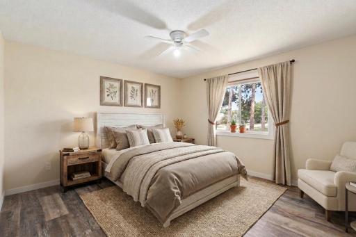 Primary bedroom - virtually staged/ showing a neutral paint color