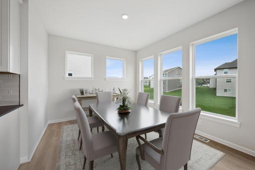 Virtually staged dining area. Photo of previously built Degan plan. Colors and selections will vary.