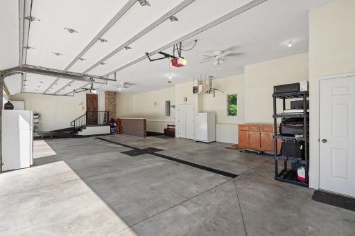 One of two oversized heated garages offers impressive space for vehicles, toys, storage and hobbies. Direct access to the lower level adds another layer of convenience and functionality. Both upper lofts are ready for your personal touches.