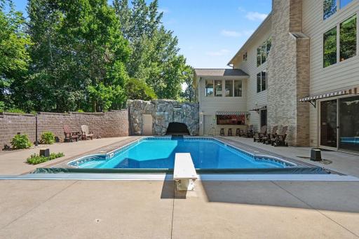 Dive right in and make this private backyard retreat your own, complete with an in-ground pool, expansive patio and rock grotto. Summer memories are waiting—make this incredible home yours today!