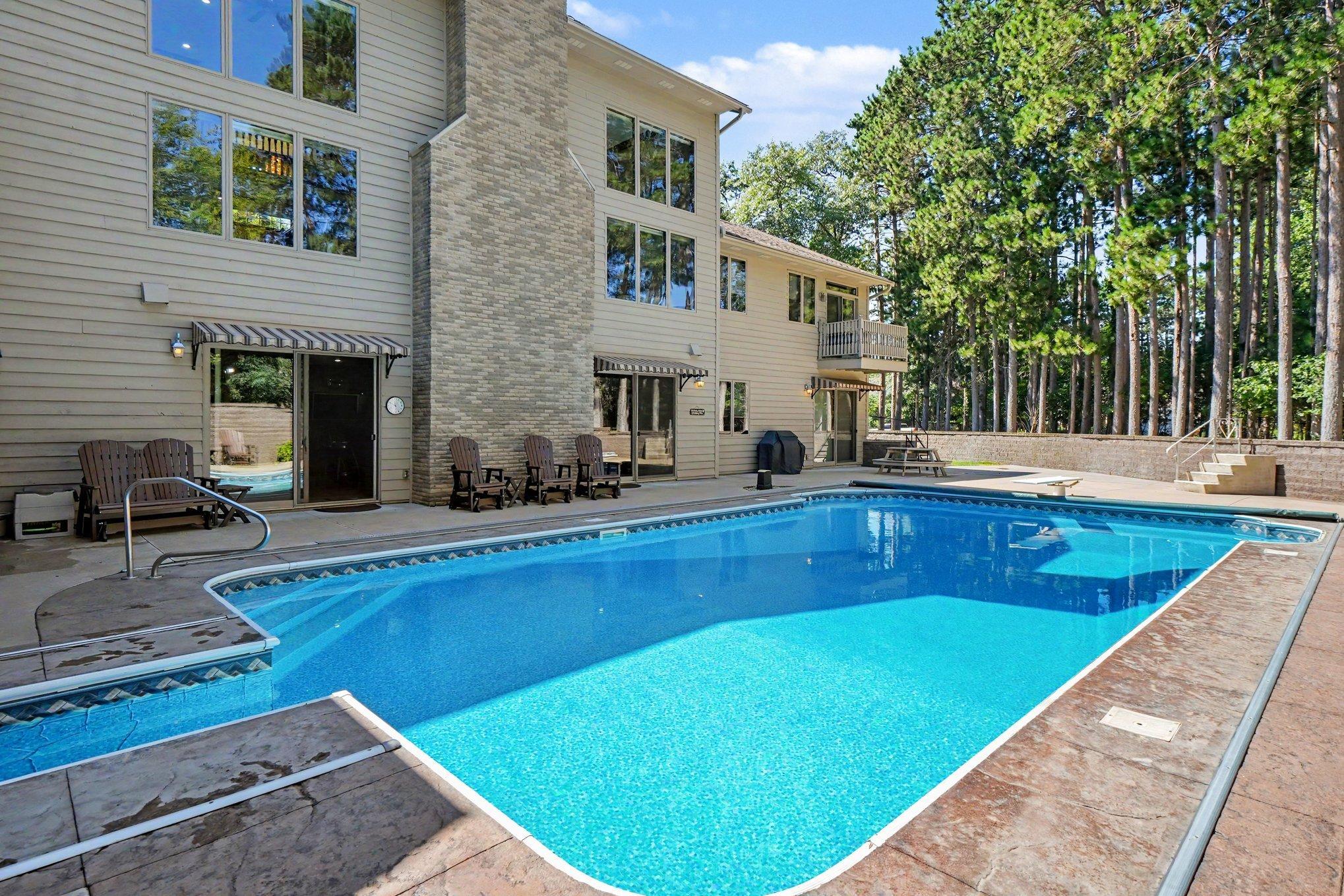 Sparkling in-ground pool creates a resort-like setting with generous patio space for lounging, entertaining and enjoying warm summer days.