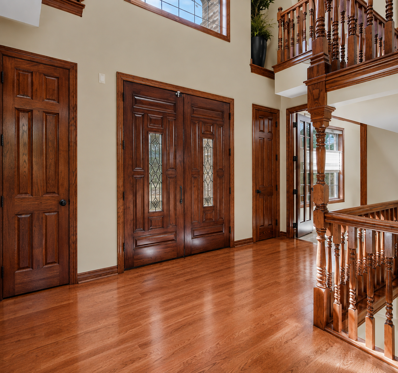 A grand main entry welcomes you with rich hardwood floors, impressive woodwork and stately 8' doors and 20' ceiling. The open staircase and warm custom finishes create an elegant first impression the moment you step inside.