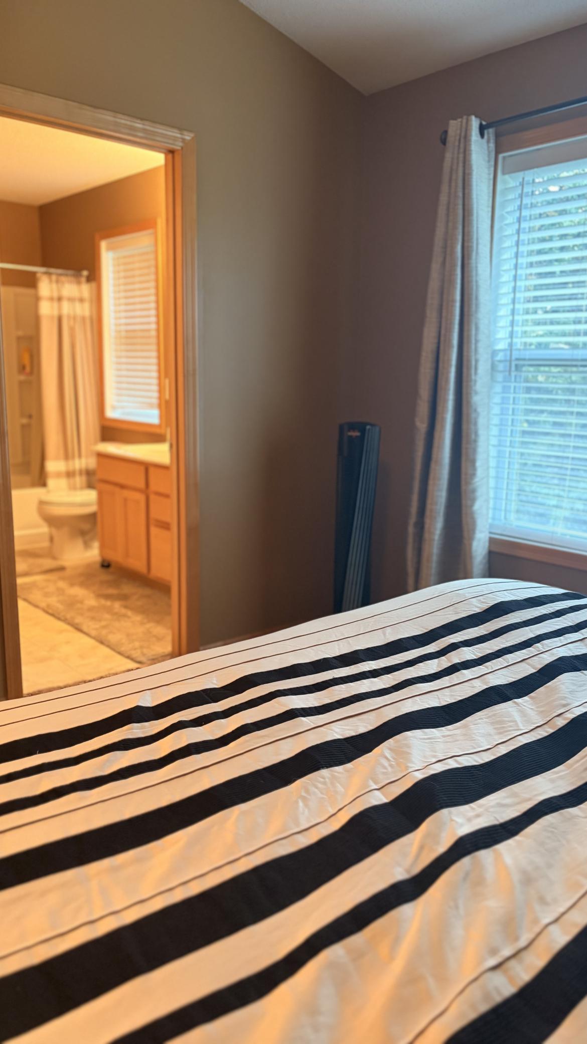 Primary view to back yard & full Bath