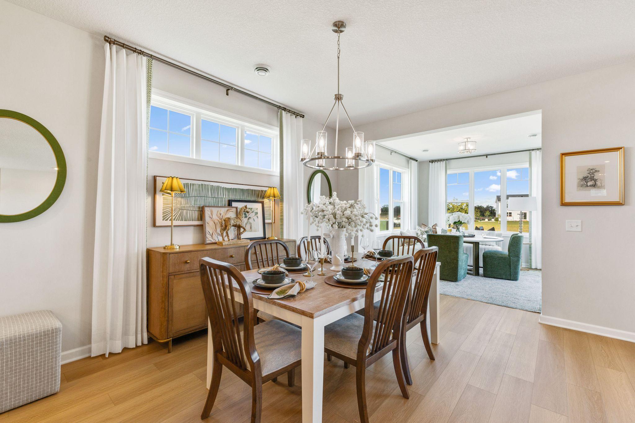 This home has tons of natural light from all the windows throughout! Photo of model home, colors and finishes may vary.