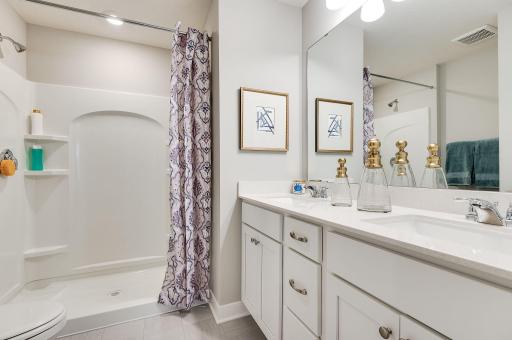 Primary ensuite bathroom with double vanity makes you feel like an executive in your own home. **Pictures are of model home; actual finishes will vary.