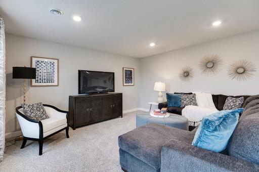 With the lower level being completely finished, the large family room provides that quiet escape from the rest of the home. **Pictures are of model home; actual finish may vary. **Actual home has a lookout basement.