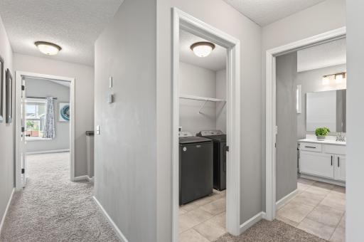 Laundry day made effortless! Situated on the upper level right next to all four bedrooms.