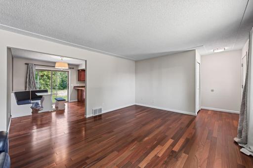 Large living room with open floorplan, fresh paint, and fully remodeled