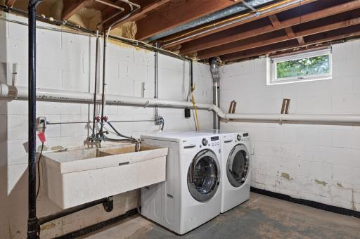 Large lower level utility room with laundry and dual sinks