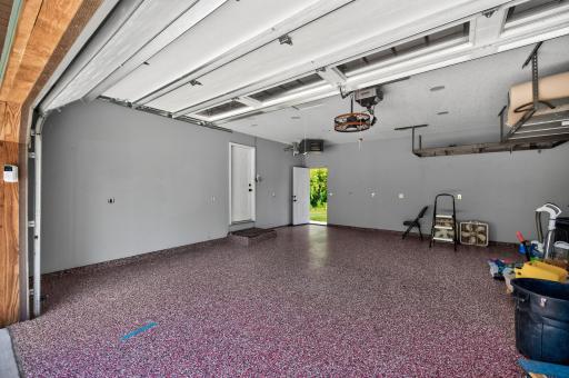 Fully finished garage with epoxy floors and heater.