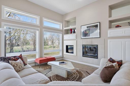 Bright and airy living room overlooking the large private backyard