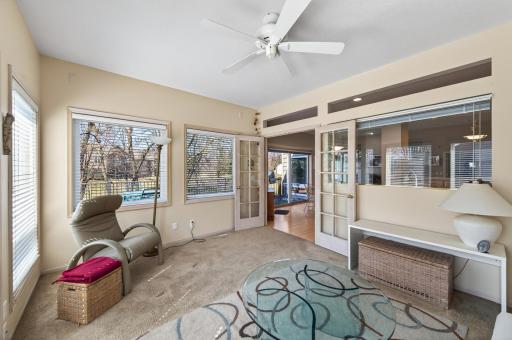 The sunroom looks out to the large backyard and maintenance free deck