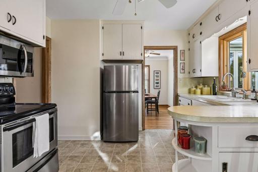 Kitchen opens to dining room and four season porch