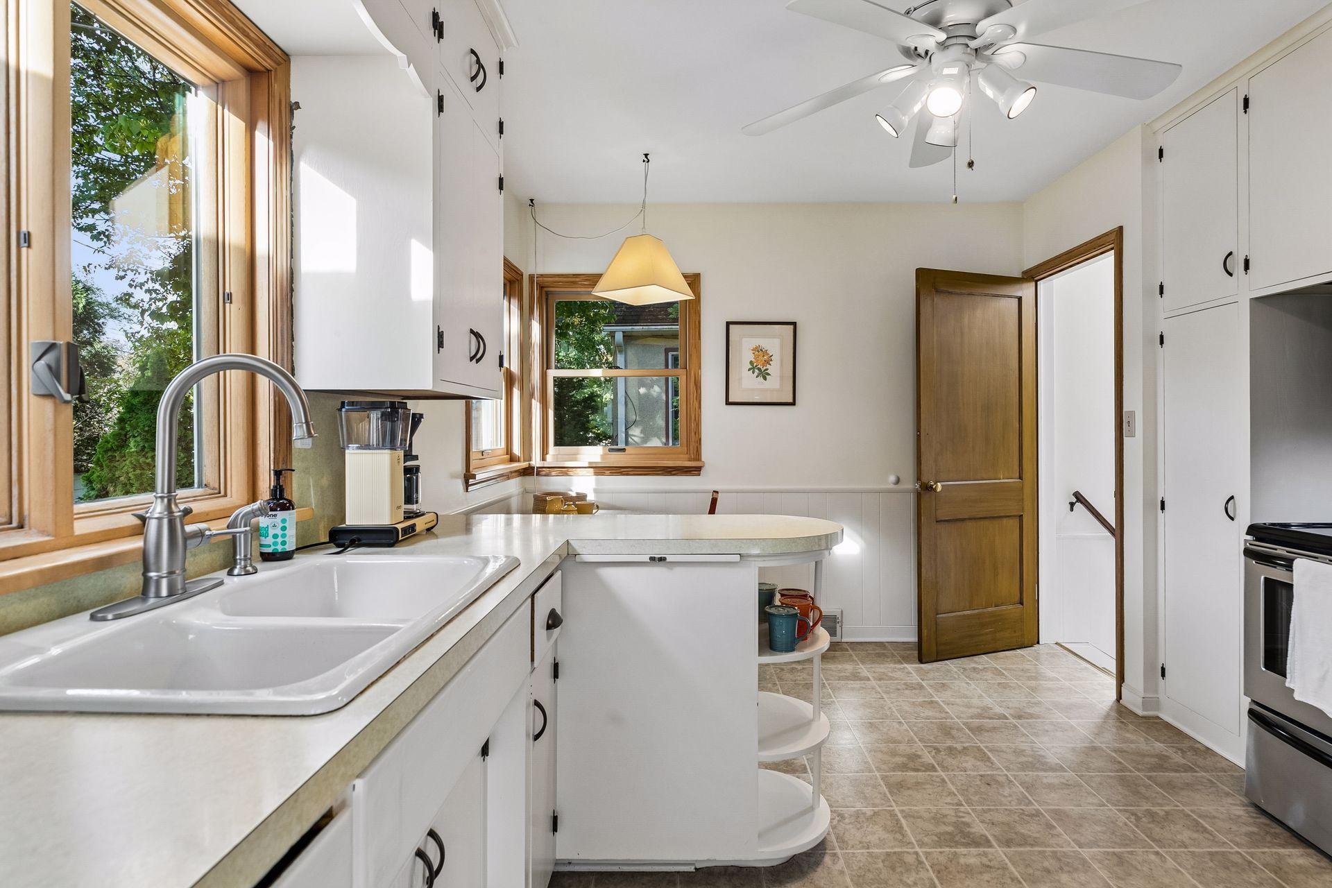 Kitchen opens to the back door and lower level