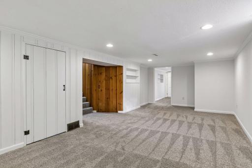 Family room opens to the utility room and the updated third bedroom and three quarter bath