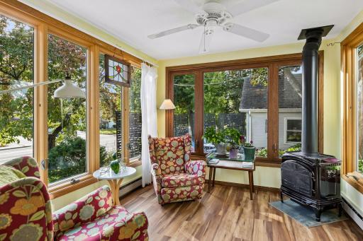 Fantastic four season porch with newer gas stove.